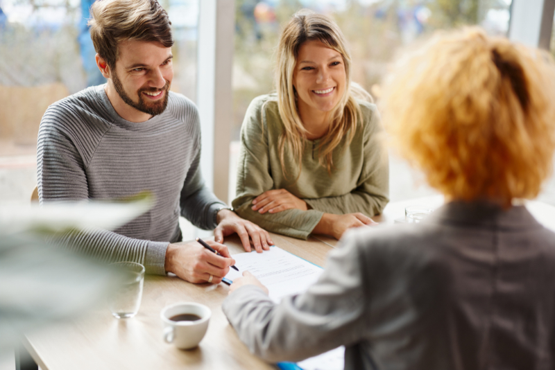 couple with estate agent